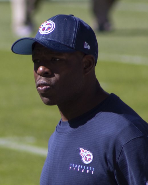 Tony Dews, running backs coach, on the field before a game.